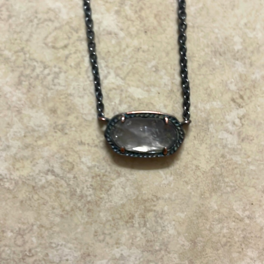 A black gun metal kendra Scott necklace